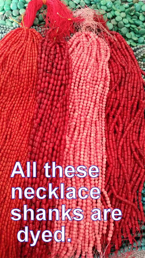 Photo of dyed red coral necklaces.